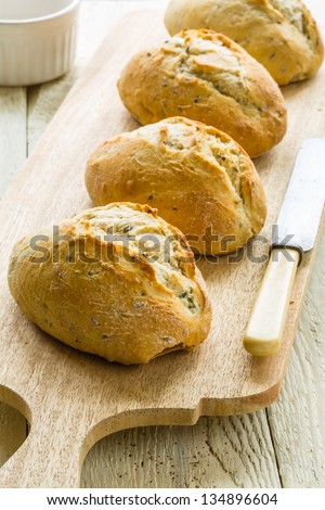 Bread rolls on a serving board