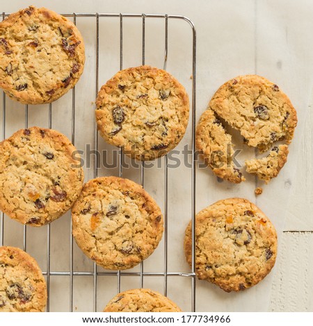 Chewy and fruity all butter flapjack cookies on a cooling tray