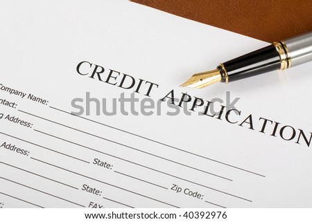 Blank Credit Application Form And Pen on desktop - stock photo Blank Credit Application Form And Pen on desktop - stock photo