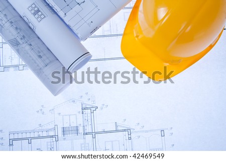 Construction Blue print and yellow hard hat