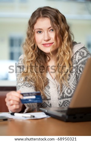 Young woman buys on the web