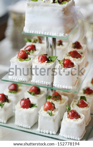Delicious fancy wedding cake made of strawberry cupcakes
