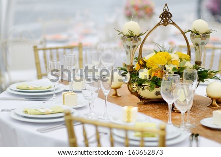Table set for an event party or wedding reception, summer theme