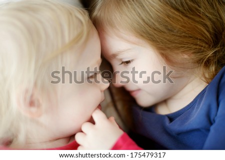 Sister love: two little girls hugging