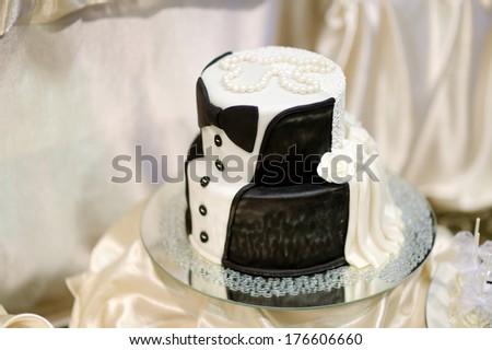 White and black tuxedo wedding cake