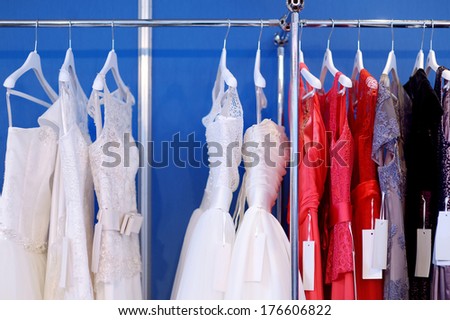 A few beautiful wedding dresses on a hanger