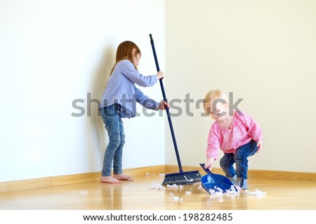 Two cute girls helping her mom to clean up