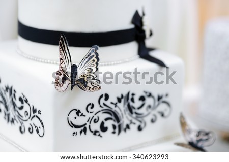 Beautiful white and black butterfly wedding cake