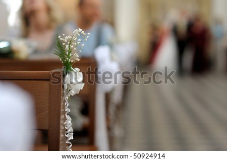 stock photo Simple flowers wedding decoration in a church
