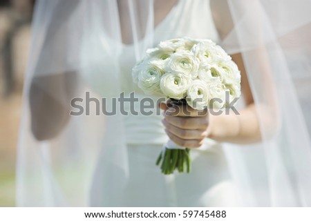 stock photo Bride holding beautiful white wedding flowers bouquet