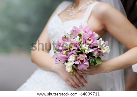 stock photo Bride holding beautiful pink wedding flowers bouquet