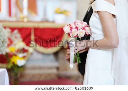 stock photo Bride holding flowers during the wedding ceremony