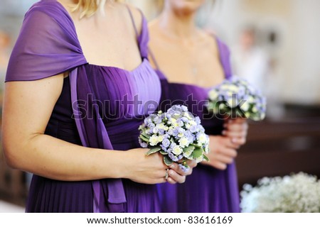 Row of bridesmaids with bouquets