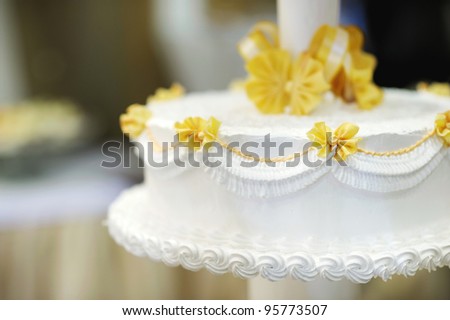 stock photo Delicious white and yellow wedding cake