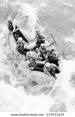 A group of men and women, with a guide, white water rafting on the Pastaza river, Ecuador ,aerial shot