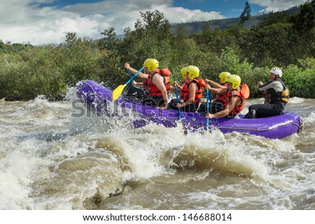 A Group Of Men And Women, With A Guide, White Water Rafting On The Patate River, Ecuador