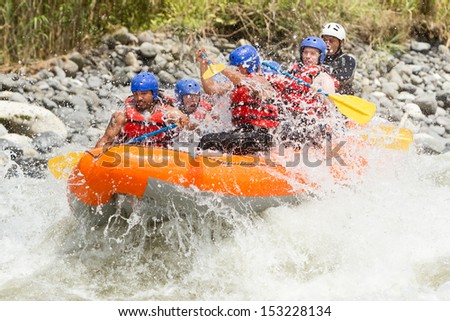 White water rafting team in bright sunlight, Pastaza river, Ecuador, Sangay National Park.