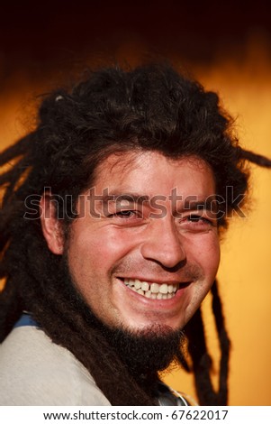 rasta man smiling, natural light portrait
