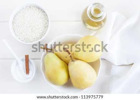 Ingredients for a rice pudding dessert: pears, rice pudding, sugar, wine.