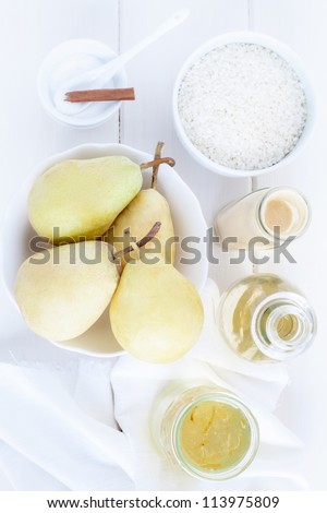 Ingredients for a rice pudding dessert: pears, rice pudding, sugar, wine, jam.