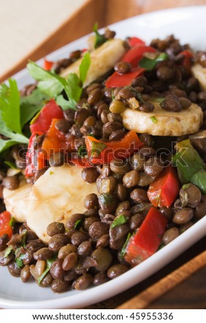 Selective focus image of an African bananas lentils salad.