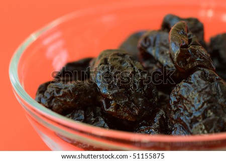 Selective focus image of dried prunes which are often in cereal products like muesli.