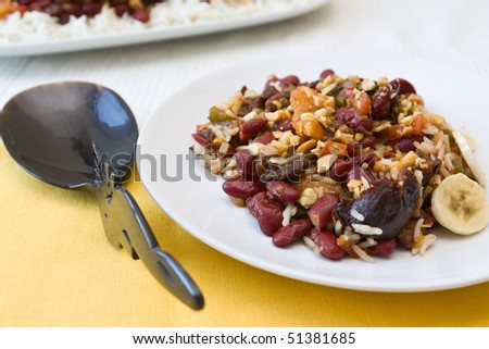Traditional South African vegetarian curry made from kidney beans and dried fruits, served with rice.