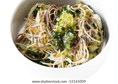 Japanese salad made from spinach, leek, soba noodle and sprouts, decorated with sesame.