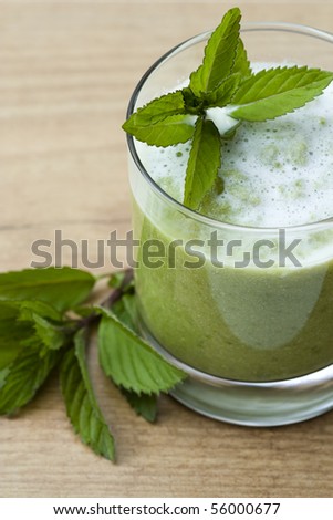 Selective focus image of a peas soup made with mint.
