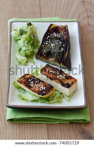 Japanese vegetarian dish made from tofu and aubergines which are marinated with miso and served with cucumber salad and sesame.