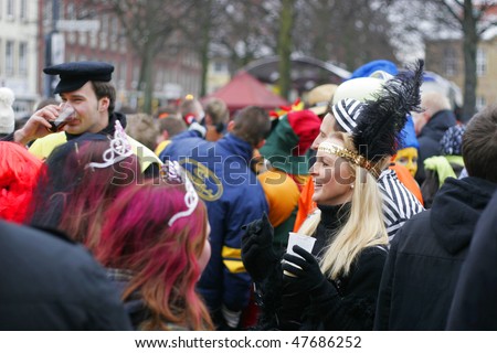 LOWER SAXONY, GERMANY - FEBRUARY 13: People in funny costumes and masquerades celebrate street carnival 