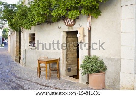A bar with table and chairs outside in Castellaro Lagusello, Monzambano, Garda lake area, Italy, Europe