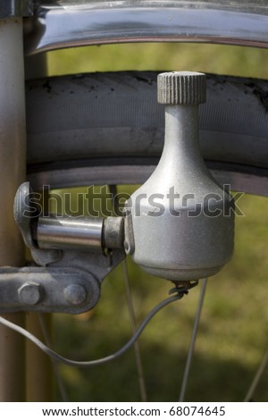Close up of a bicycle dynamo, a small generator making the lamp of the bicycle light up when pedaling the bike