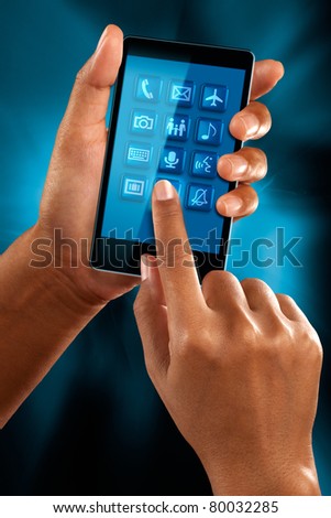 A woman use a mobile phone to select a application
