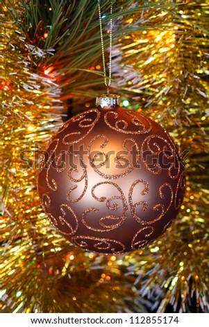 close-up ornament christmas ball at bright, colored background