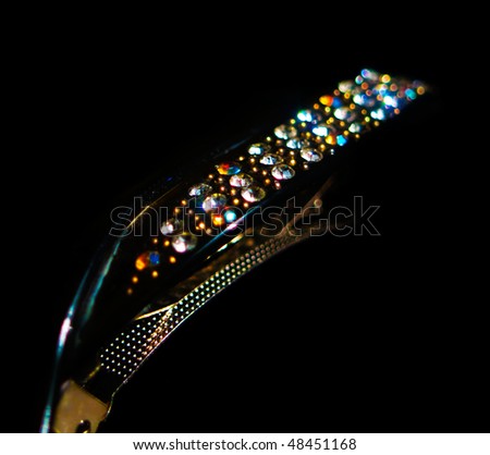 Row of stones on a clip isolated on black