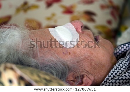 ill person with eye bandage