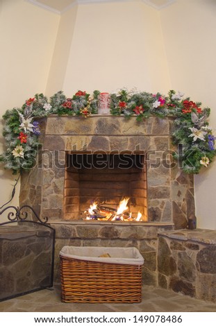 fireplace decorated with noel ornaments