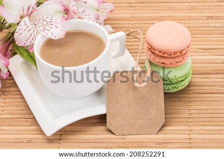 colorful macaroons and coffee with name tag