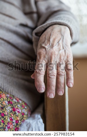 wrinkled hand of a senior person
