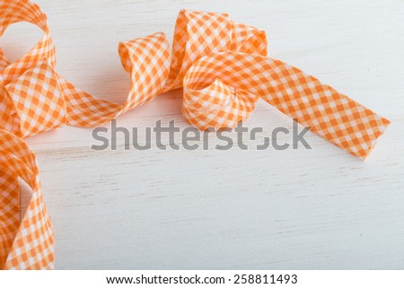 ribbon border on wooden background