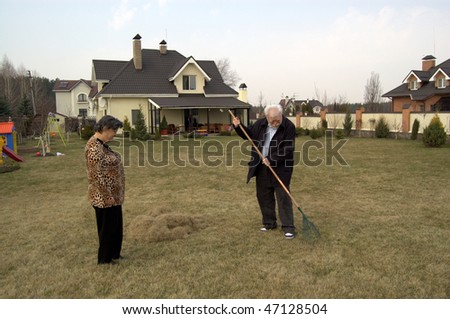 old people gardening on their backyard