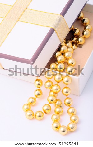 golden jewel in a opened gift box