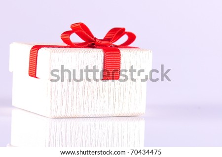 gift box with red ribbon on white