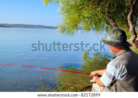 fisherman by lake (sea)