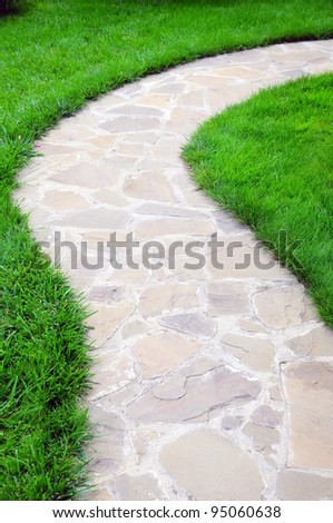 path on a garden surrounded grass