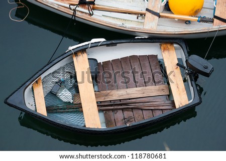 Small fishing tender boat overhead view