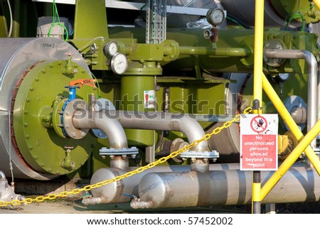 Green Industrial Boilers and Pipework with Warning Sign