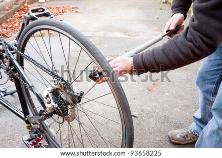bike maintenance pumping up tyre