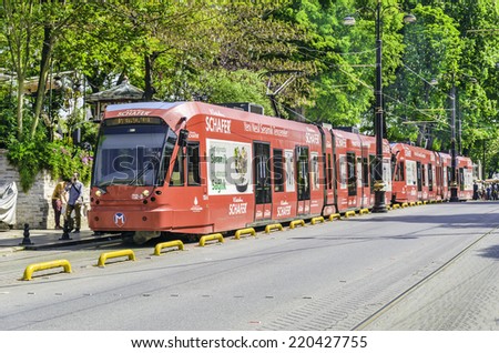 Istanbul, Turkey - April 5, 2014: Modern Trams in Beyazit District.Modern electric rail tram turning to Sirkeci.
